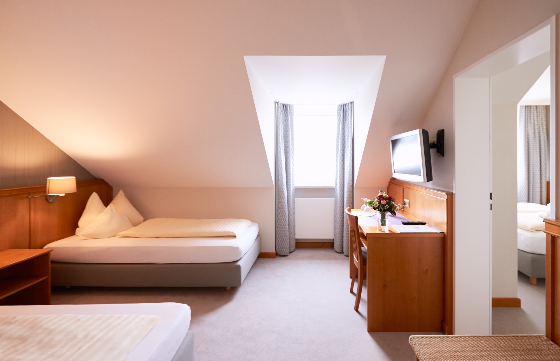 Family room with two separate bedrooms and a bathroom with shower